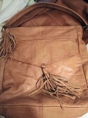 ANTHROPOLOGIE!! LEATHER TAN W/TASSELS!! 14 IN X 14 IN